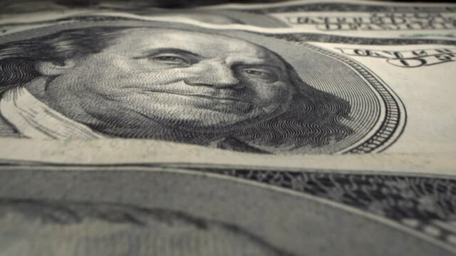 Hundred-dollar money of the United States of America very close-up. Portrait of Franklin on a paper bill macro. Business, income and expense concept