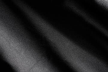 Elegant black silk, luxurious fabric texture, elegant background design.