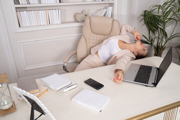 Crime scene with strangled pretty business woman in office..