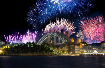 Sydney Harbour Bridge New Years Eve fireworks, colourful fire works lighting the night skies with vivid multi colours