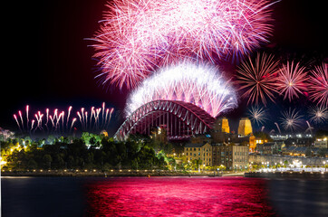 Sydney Harbour Bridge New Years Eve fireworks, colourful fire works lighting the night skies with...