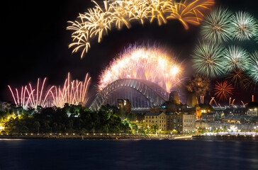 Sydney Harbour Bridge New Years Eve fireworks, colourful fire works lighting the night skies with vivid multi colours