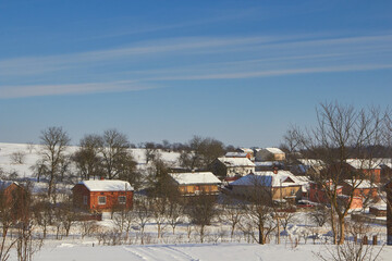 Fototapeta na wymiar rural landscape in winter,rural houses in ukraine in winter