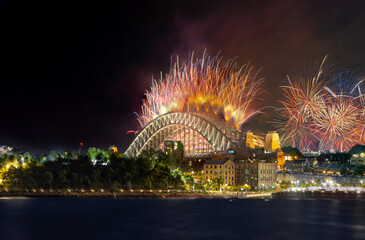 Sydney Harbour Bridge New Years Eve fireworks, colourful fire works lighting the night skies with vivid multi colours