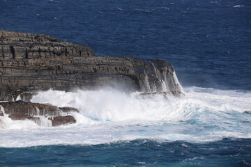 waves crashing on rocks