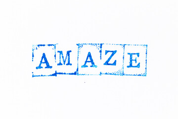 Blue color ink rubber stamp in word amaze on white paper background