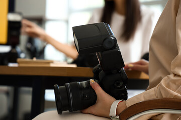 Female photographer during classes in studio