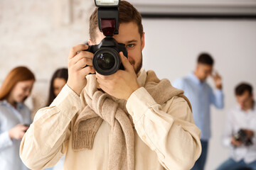 Male photographer during classes in studio