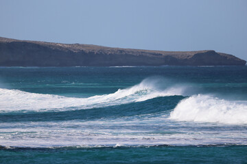waves crashing on a rock