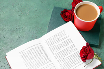Cup of tasty coffee, books and roses on green background