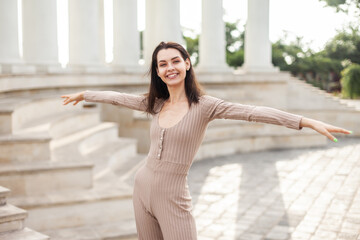 Cheerful young woman having fun in the city.