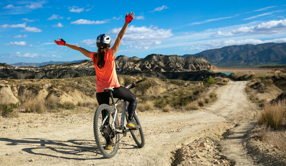Fototapeta happy woman in mountain bike obraz