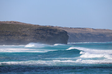 waves crashing on rocks