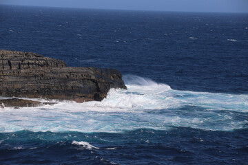 waves crashing on rocks