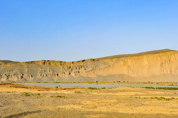 The boundless natural scenery of the Gobi Desert in Xinjiang, China, captured from a moving car