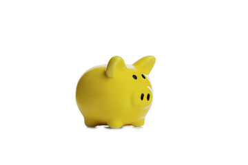 Ceramic yellow pig piggy bank. Investments and savings. Isolated on white background.