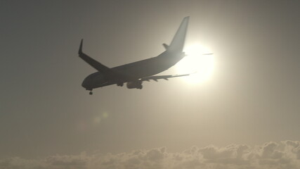 Plane flight against the sunlight