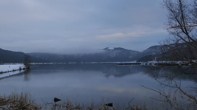 Video of Lake Yogo, Shiga Prefecture, in the dead of winter, with the surrounding area covered in white snow, a frozen landscape.