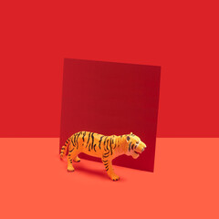 Abstract concept of Chinese tiger zodiac new year celebration with red card beside. Red background...
