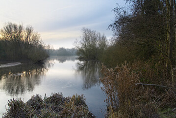Mist across a lake on a cold, frosty winter morning.