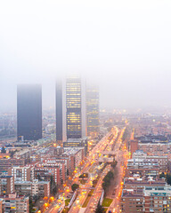 Views of the Castellana in the city of Madrid during a very cloudy winter day, with views of the financial area and the skyscrapers
