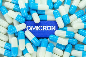 blue and white medicine with the word Omicron or the latest virus