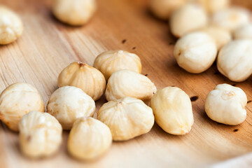 dried hazelnutsnuts on a wooden table