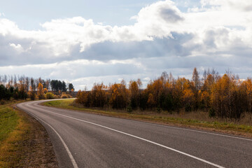 Fototapeta premium an asphalt road in the autumn season