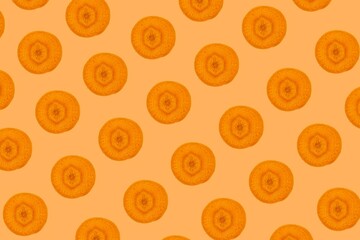 Carrot slices pattern, top view of carrot slices isolated on orange background.