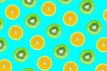 Fruits seamless pattern. Kiwi and lemon slices isolated on blue background.