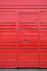 Metallic red door of a warehouse