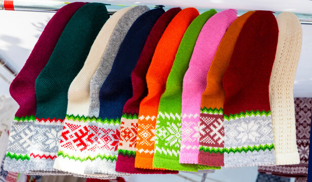 Hand-knitted socks with traditional Latvian characters.