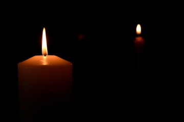 burning candles showing the way in the dark