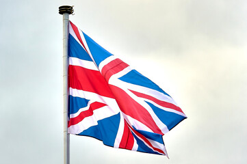 the flag of Great Britain is flying on the flagpole