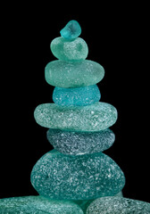 pieces of sea glass isolated on black background
