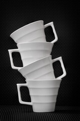 Photo of stacked white coffee cups