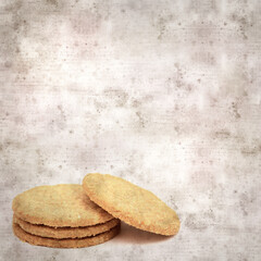 square stylish old textured paper background with round baked oatcakes