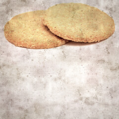 square stylish old textured paper background with round baked oatcakes