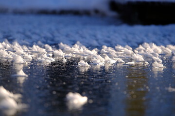 Fascinating ice crystalls on a frozen lake - 477853983