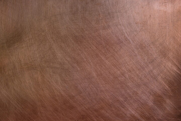 Texture of copper sheet. Copper background. Lighting on the right. Indoor. 