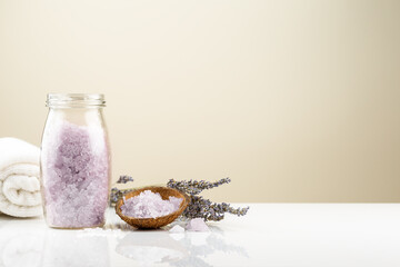 Lavender bath salt in a glass jar with flowers