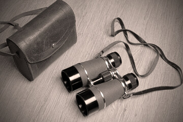 pair of vintage binoculars and leather case.