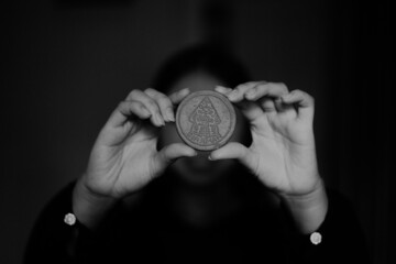 Plakat businessman holding a coin