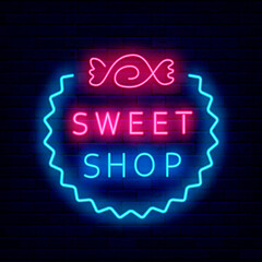 Sweet shop neon sign with candy. Night bright signboard on brick wall background. Isolated vector illustration