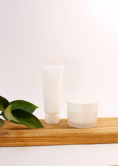 composition with body cream, soap and essential oil.