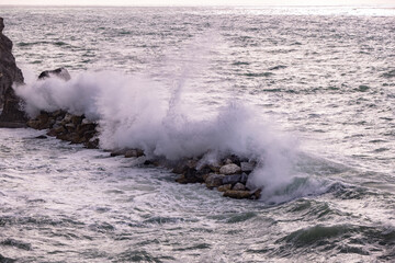 Strong waves hit against the coast of Cinque Terre in Italy - travel photography