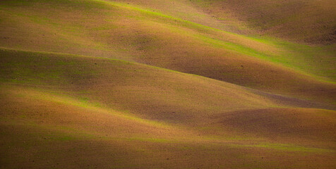 Colorful Tuscany in Italy - the typical landscape and rural fields from above - travel photography