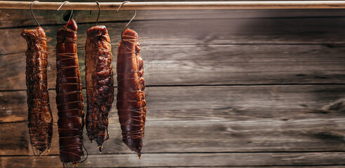 smoked pork ham on wooden background. Natural product from an organic farm, banner, menu, recipe...