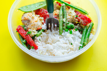 Cooked chicken breast pieces in a red Thai curry sauce made with coconut cream, red chillies, lemongrass, lime leaf, with fragrant rice, red peppers, mangetout, and green beans