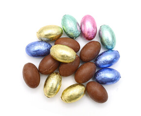 Fototapeta na wymiar Chocolate easter eggs in colorful foil on white background